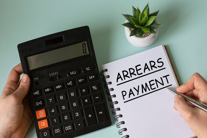 What Does Paid in Arrears Mean?